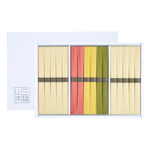 白い箱に白・赤・黄・緑のそうめんが入っている