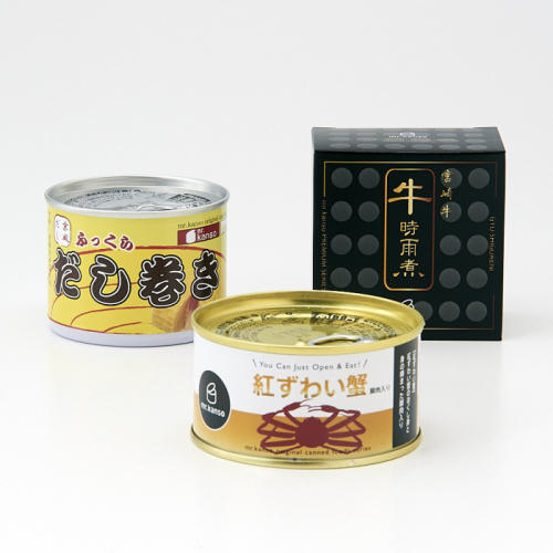 だし巻き缶、カニ缶、しぐれ煮缶が置かれている。
