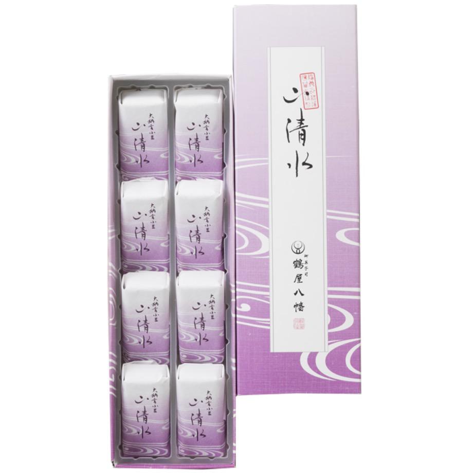 紫の化粧箱に並んだ8個の個包装の和菓子