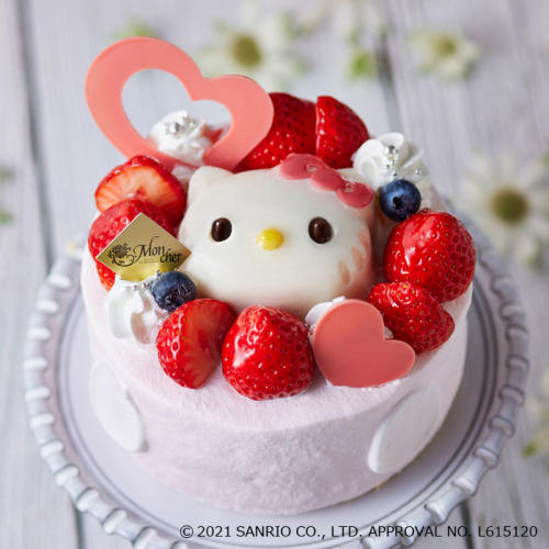 ハローキティのババロアがのったホールサイズのピンク色のケーキ。