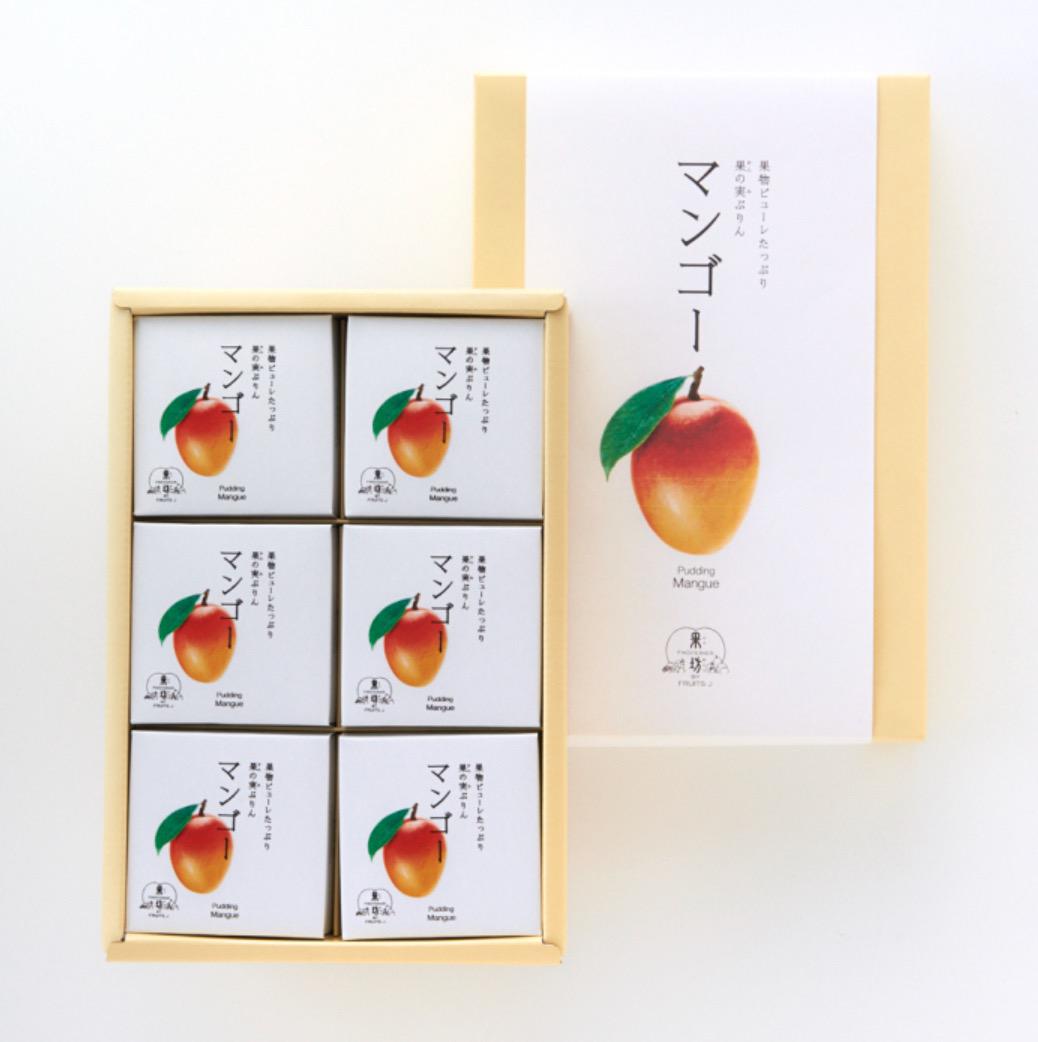 マンゴーが描かれたパッケージと肌色の化粧箱に入った6つの小分けパック
