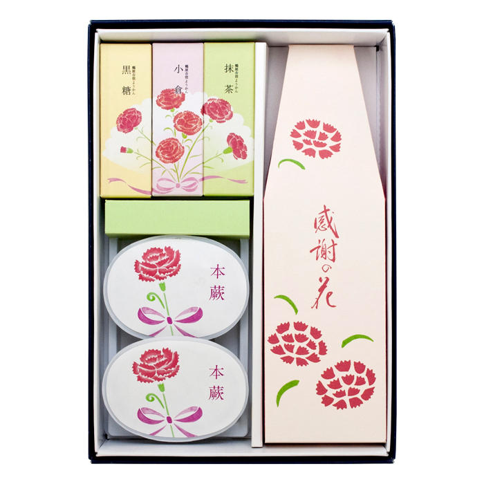 感謝の花、本蕨、鶴屋吉信ようかんのパッケージが並んでいる