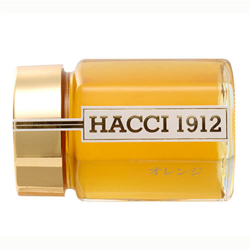 オレンジ色のはちみつが瓶に入っている「HACCI 1912」の「メキシコ産オレンジはちみつ」
