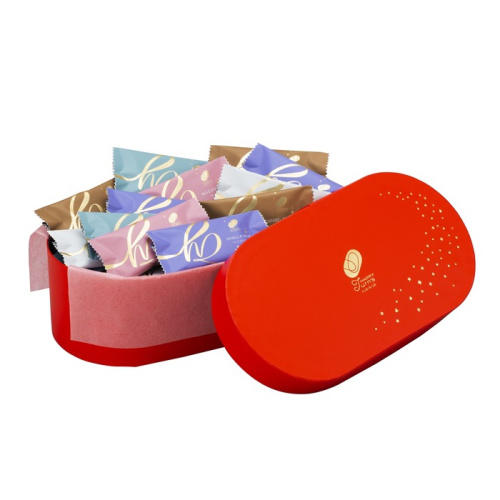 赤い缶に入れられたハッピーターンズの詰め合わせ